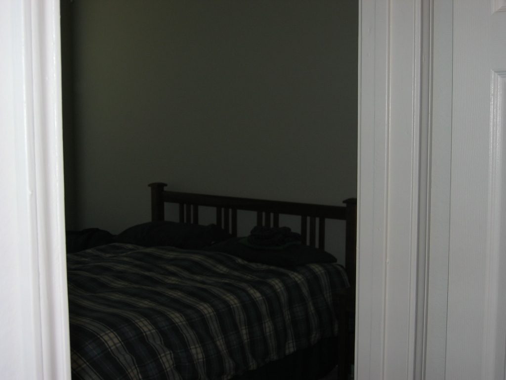 Entrance to bedroom across the hall from bath