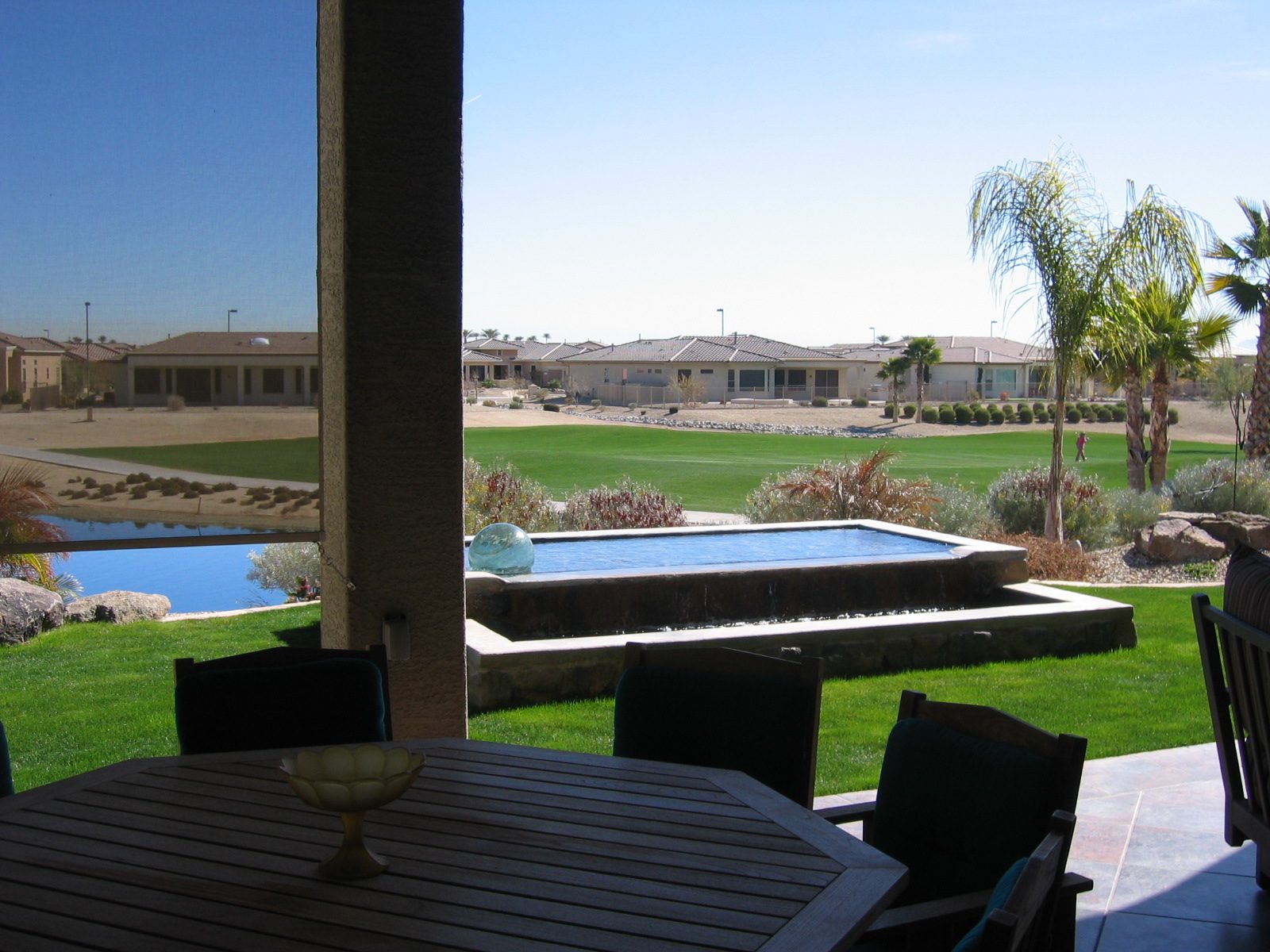 and the gurgly fountain just off the outdoor living room ... looking across the golf course to...
