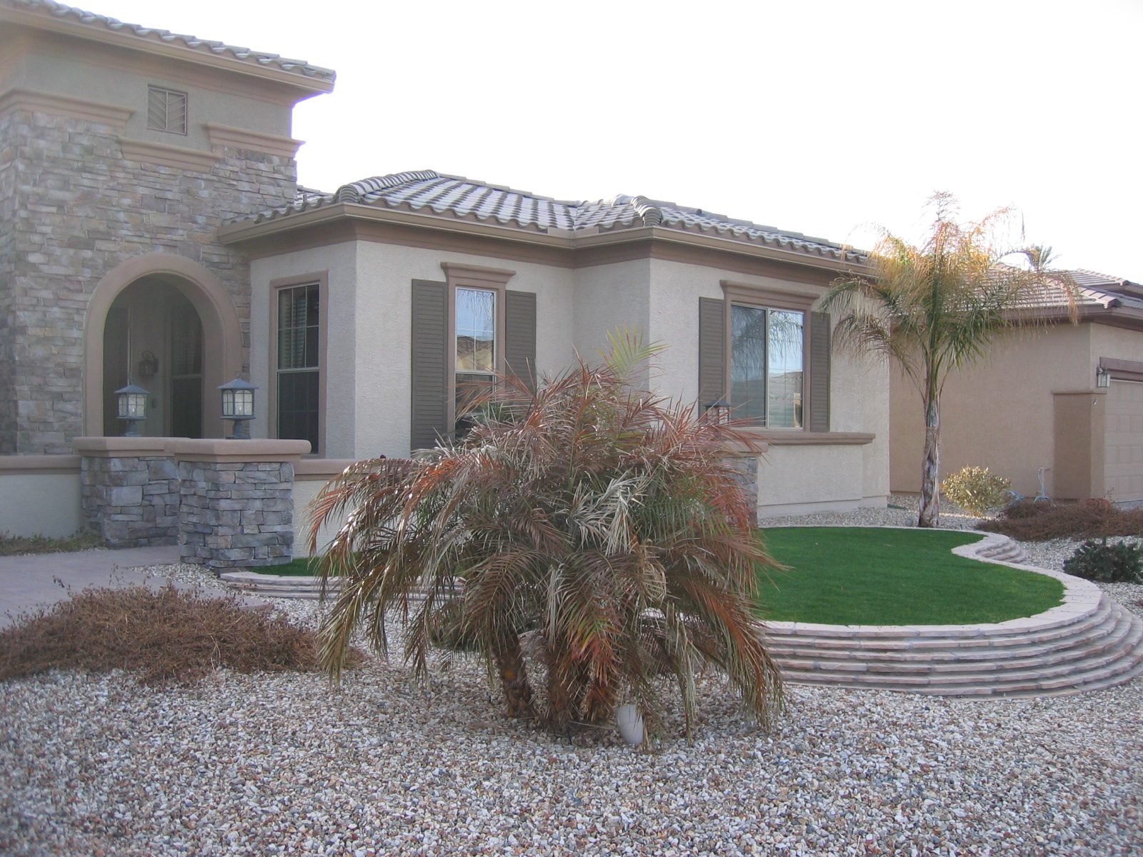 Some of the landscaping, including Bruce's quite green grass ... an anomaly on the street