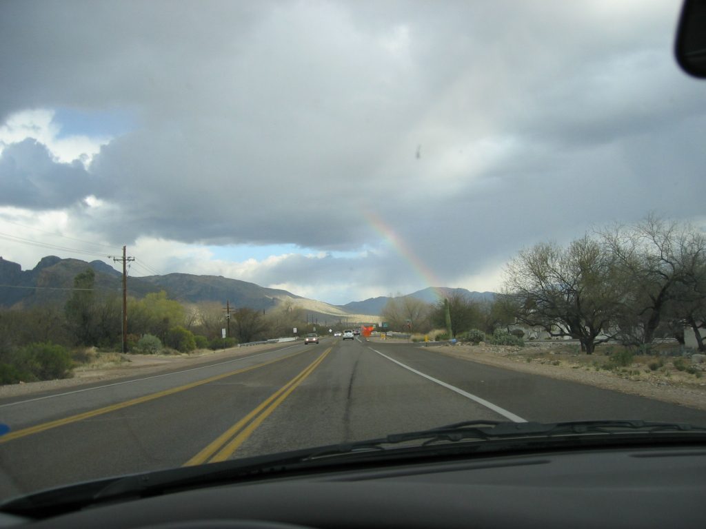 Should one really try to photograph a rainbow while driving?