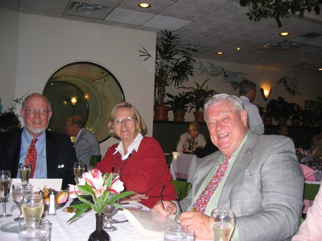 The other end of the table is a little more serious - except for our ever-smiling emcee.