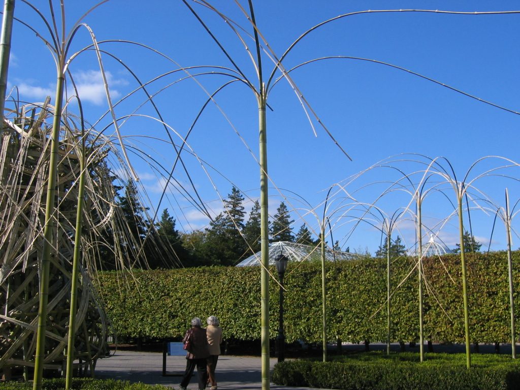 The major sculpture was surrounded by poles of bamboo that had been split at the top and waved...