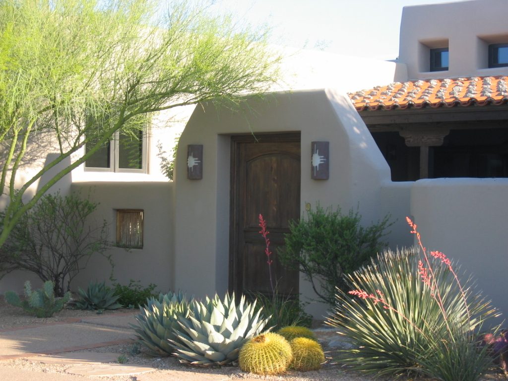 The 'windows' in the courtyard wall are filled with ocotillo branches, I believe.  The other...