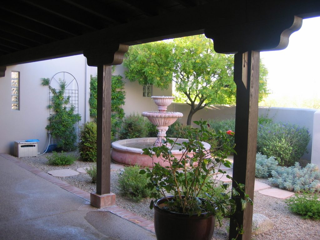 Courtyard with potted hibiscus.