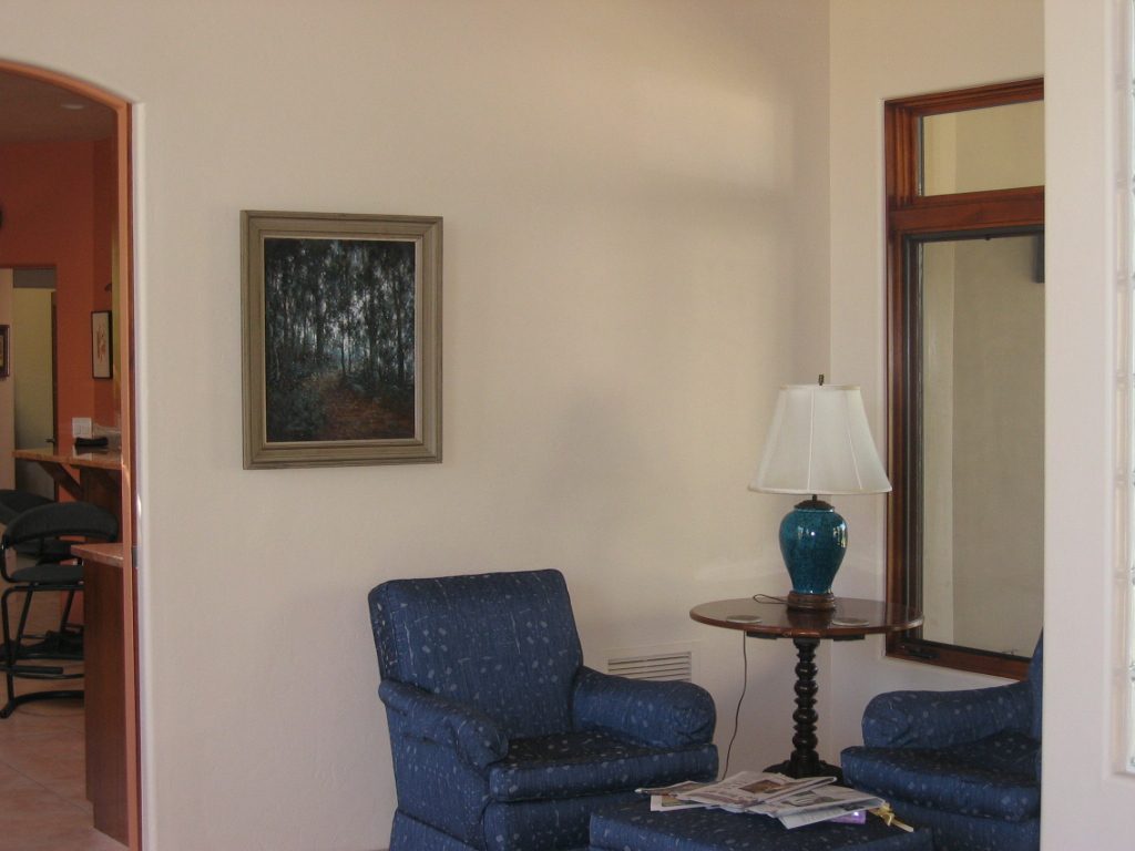 SE corner of the LR.  Great reading nook with excellent light.  The Roy Nichols oil is also a...