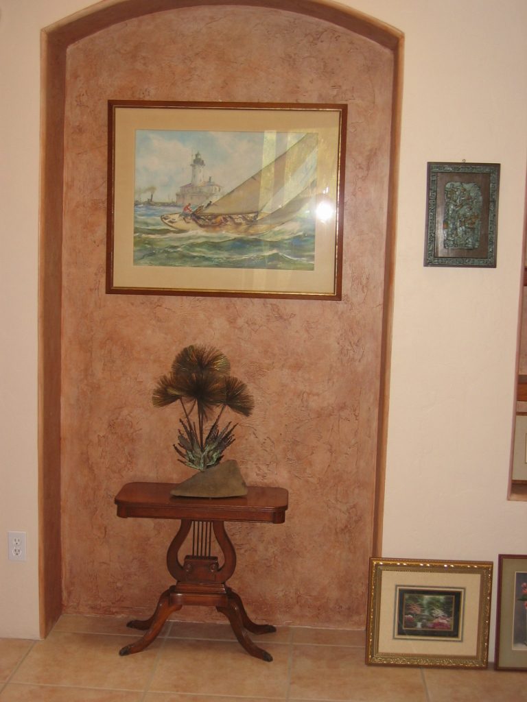 A possible use of the hallway alcove.  The oxidized copper leaves of the sculpture work...