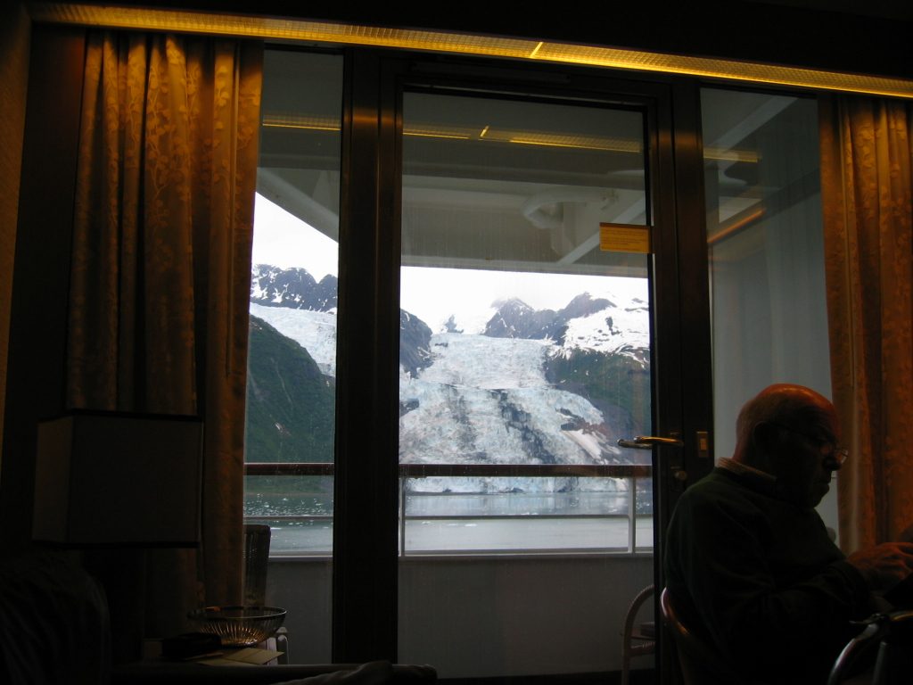 This was still in College Fjord, with some glacier in background.  Peter seems intent on his reading.