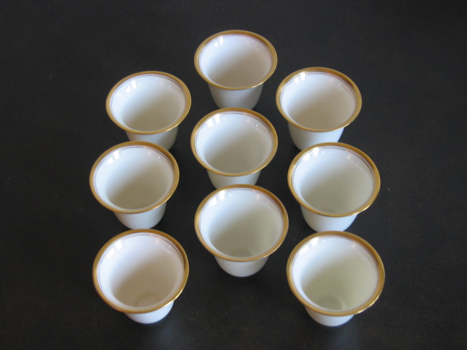 Nine tiny (2 oz?) demitasse cups.  No saucers.