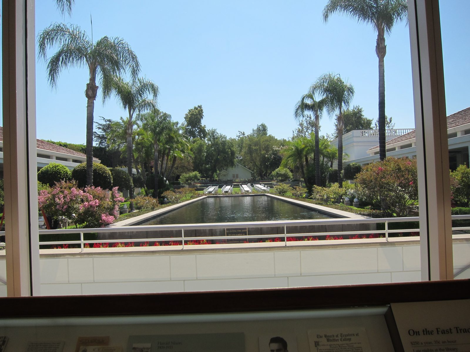 The small house at the far end of the reflecting pond is Nixon's childhood home.  There are...