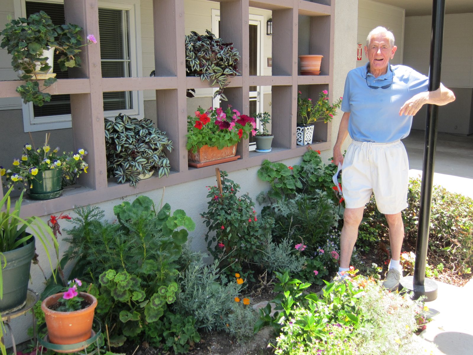 Paul and the garden he planted in the area between apartments. It had been all weeds and he was...