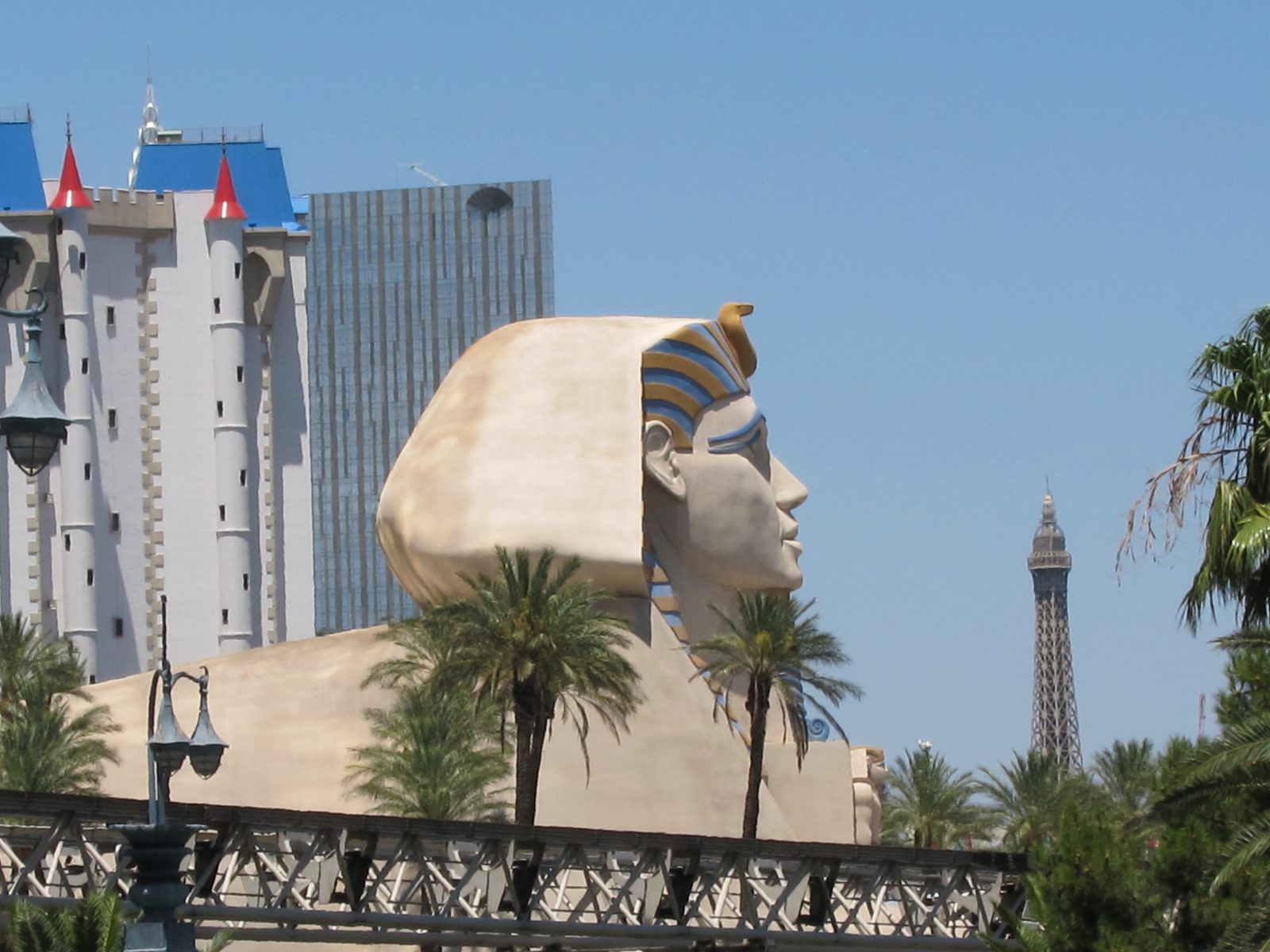 The Sphinx gazing at the top of the Eiffel Tower.