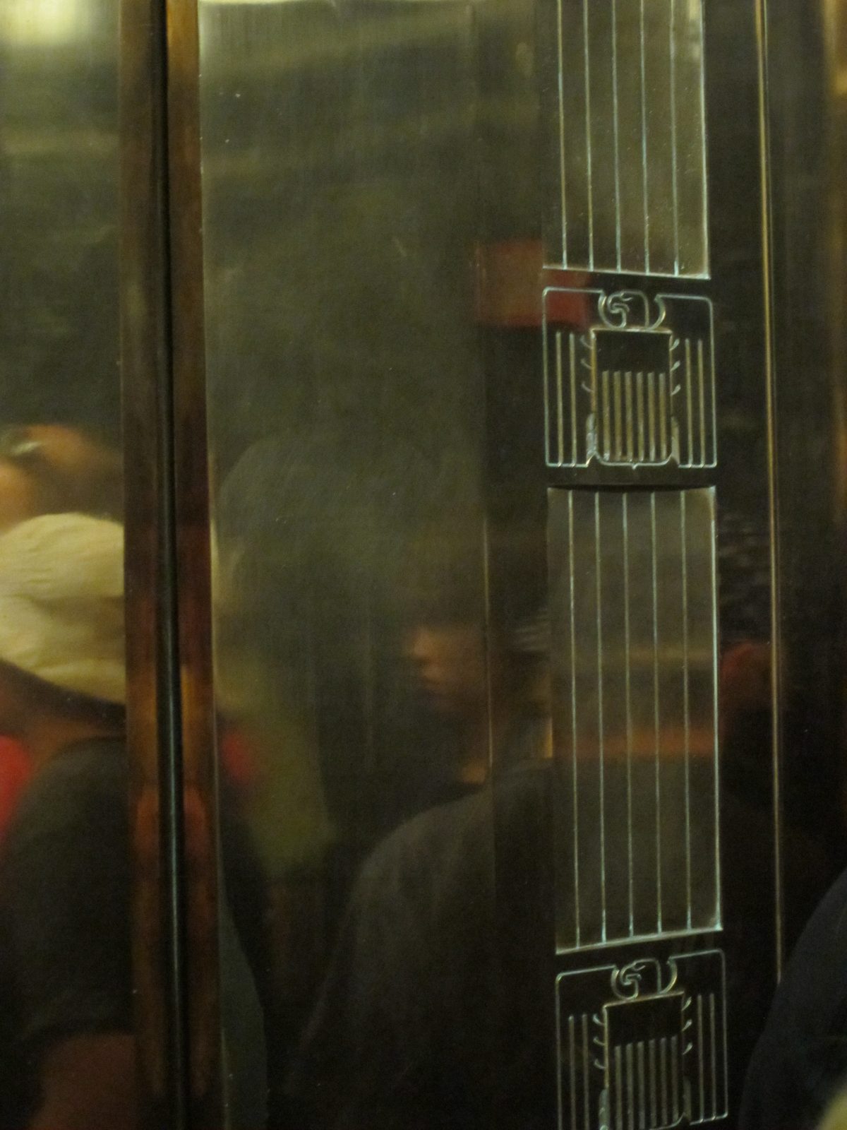 Decorative eagle flourish on the elevator door.