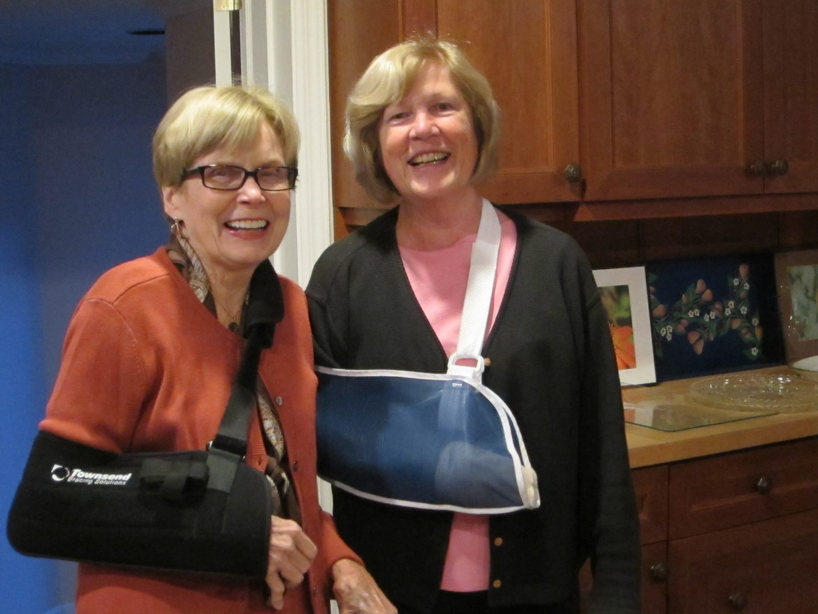 Margaret Anderson (bad fall on the shoulder) and Judy comparing arm slings.