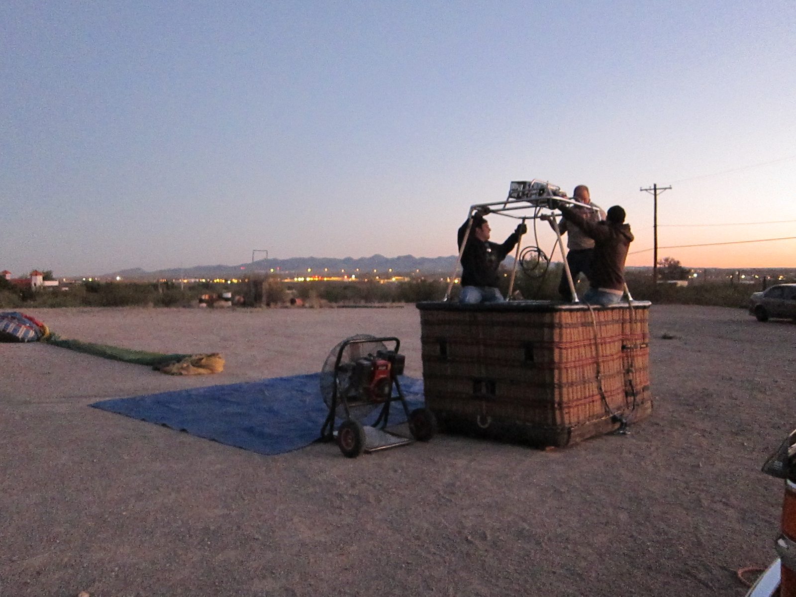 Kevin, James and Jim wrestle with the frame as the Eastern sky lightens