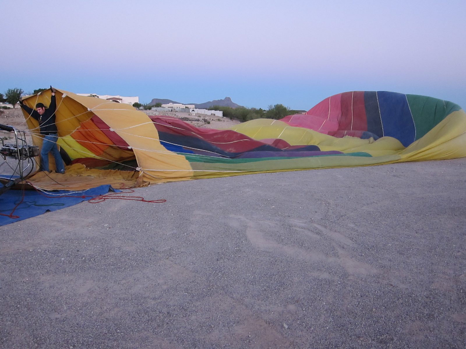 Jim holds the mouth open as a giant fan blows the ambient air into the balloon.