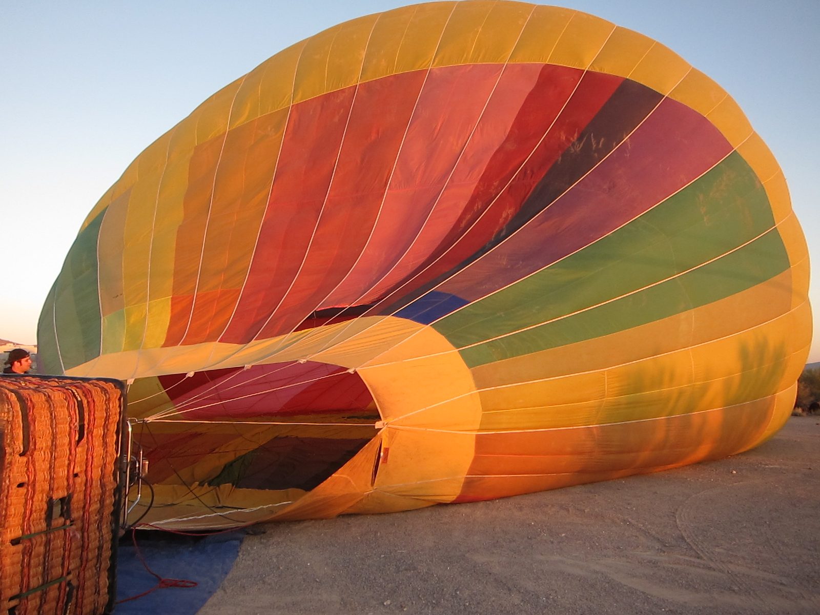 Sun has broken the horizon and really illuminates the balloon.  Basket is on its side to line up...