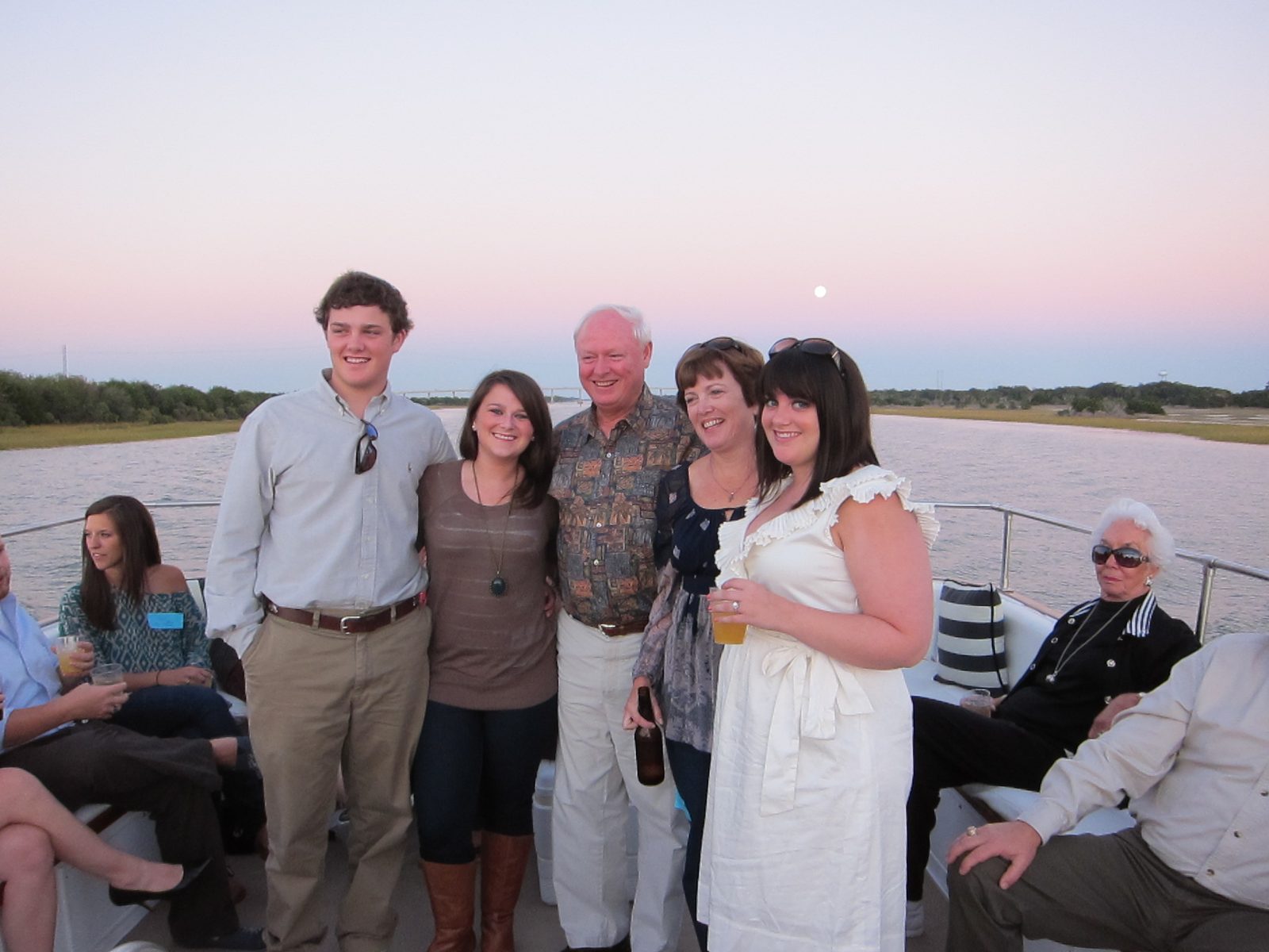 One of the groomsmen, Kate (bride's sister), bride's Dad Chris, mother Susan and Grace, the...