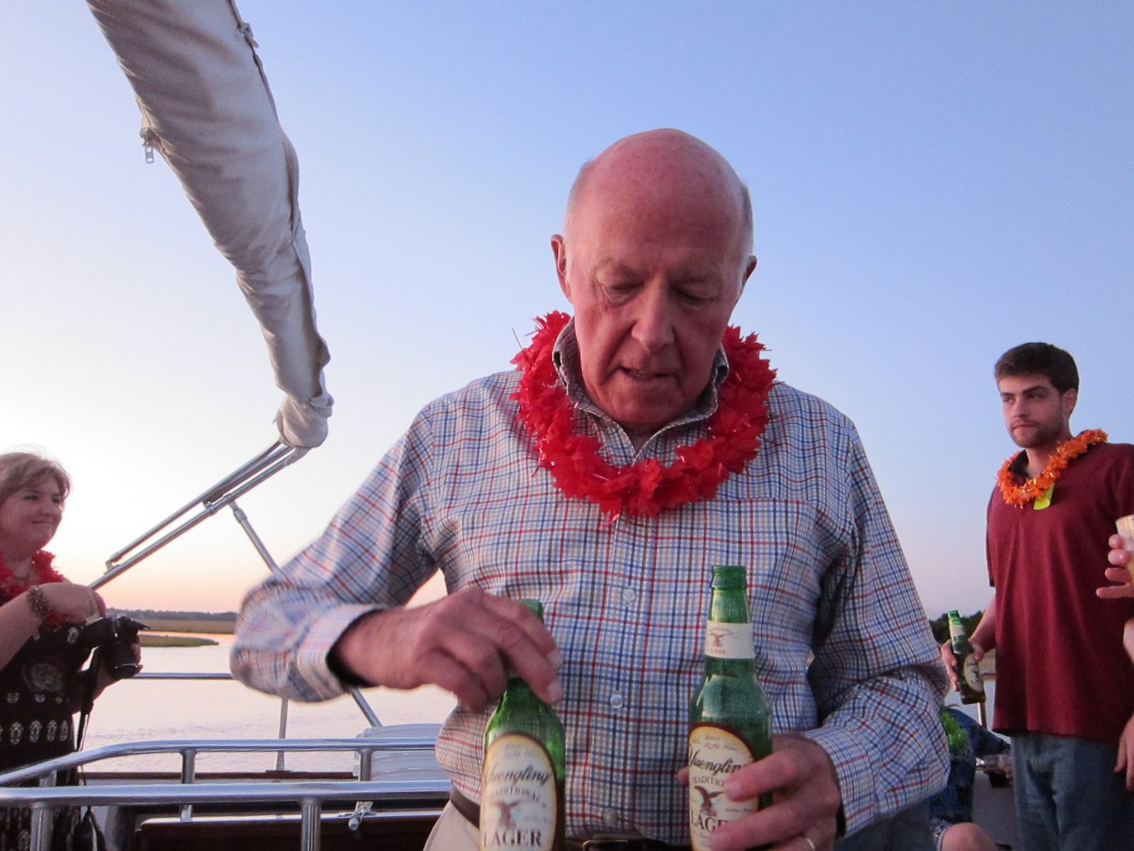 Dad does like that Yuengling.  Getting into the party spirit with his lei.  I think Mike...