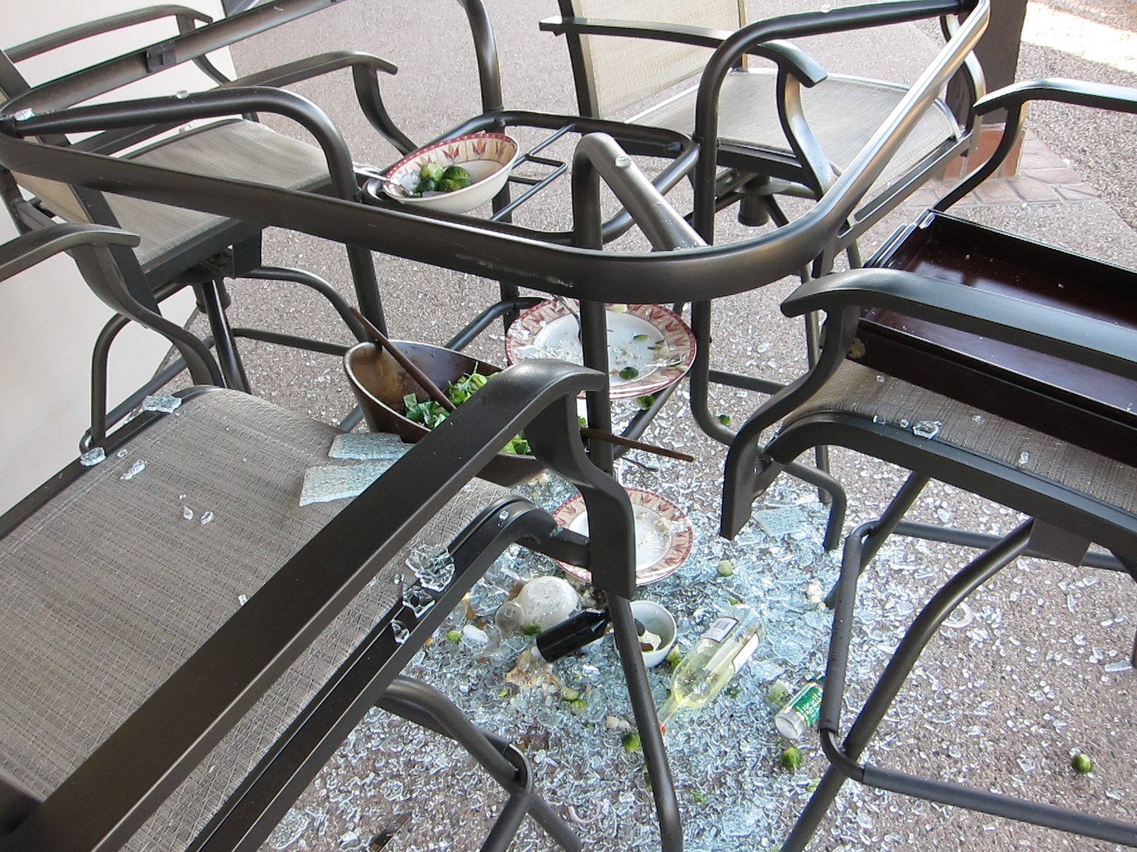 the glass just buckled inwards, the dinner platters just rode it down intact as did the bowl...