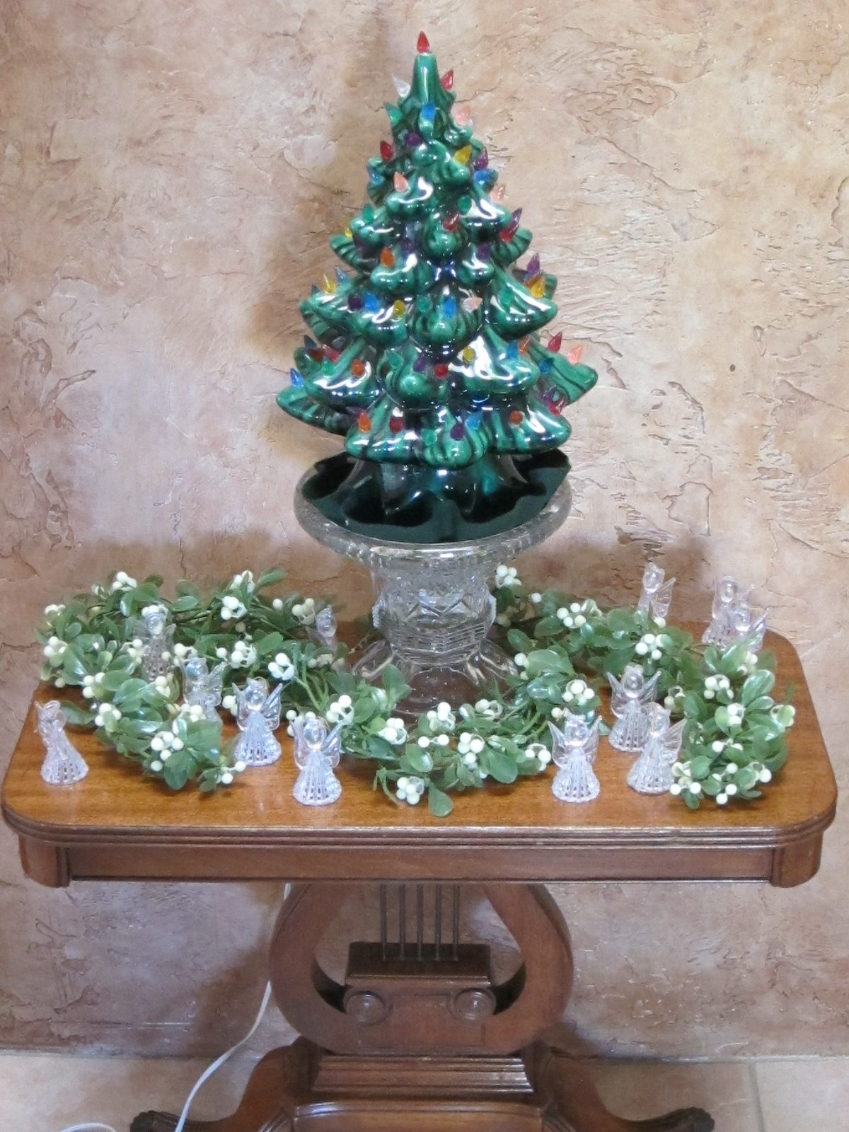where there is a little tree, and some angels dancing about.