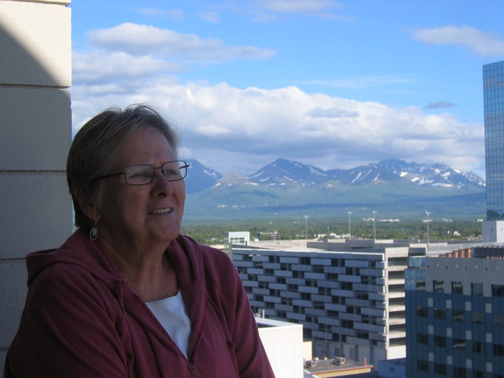 Having arrived in Anchorage, standing on the balcony of the Westmark.  Chugach Mountains in the...