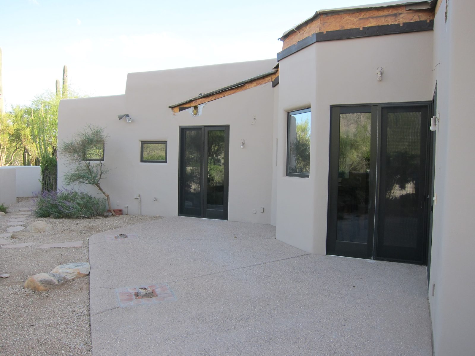 Closer view of the area.  The window to the left of the right most doors (which lead to the...