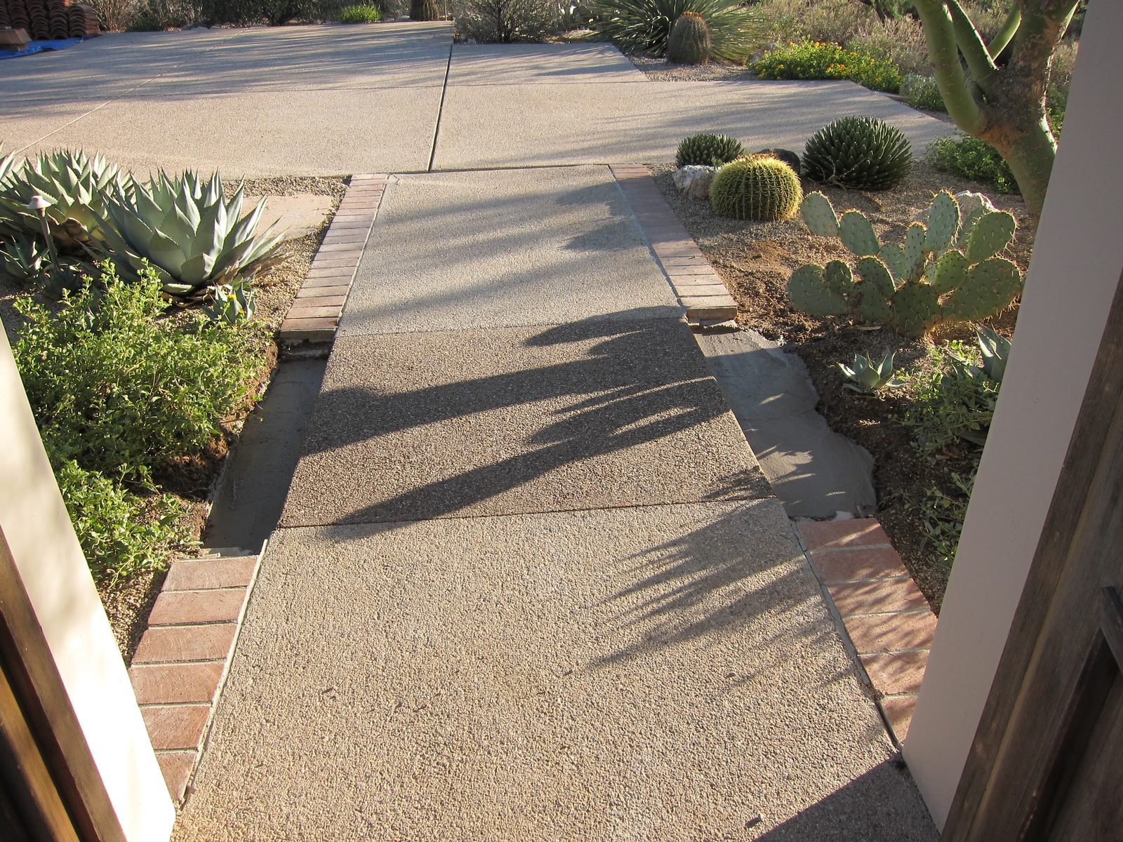 New slab out front has also colored out very close to the existing.  They'll replace the brick...