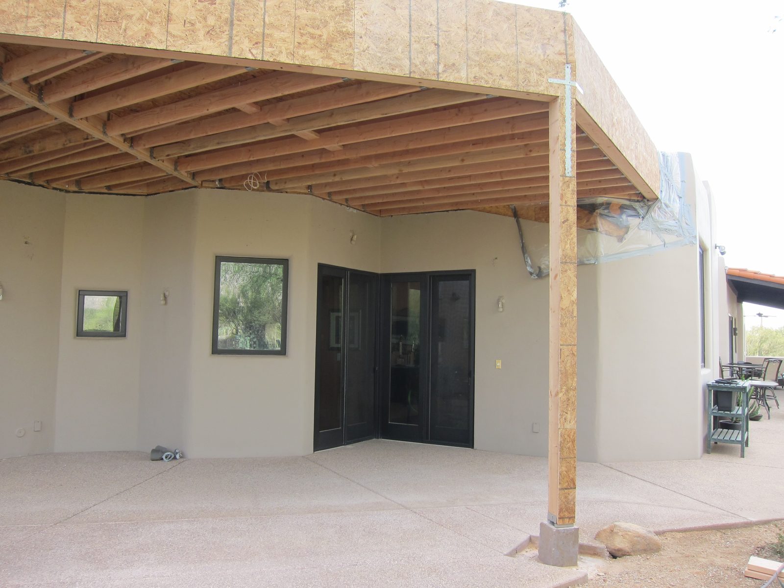 The little window is in the bathroom.  The wall to it's right is getting a large window; and the...