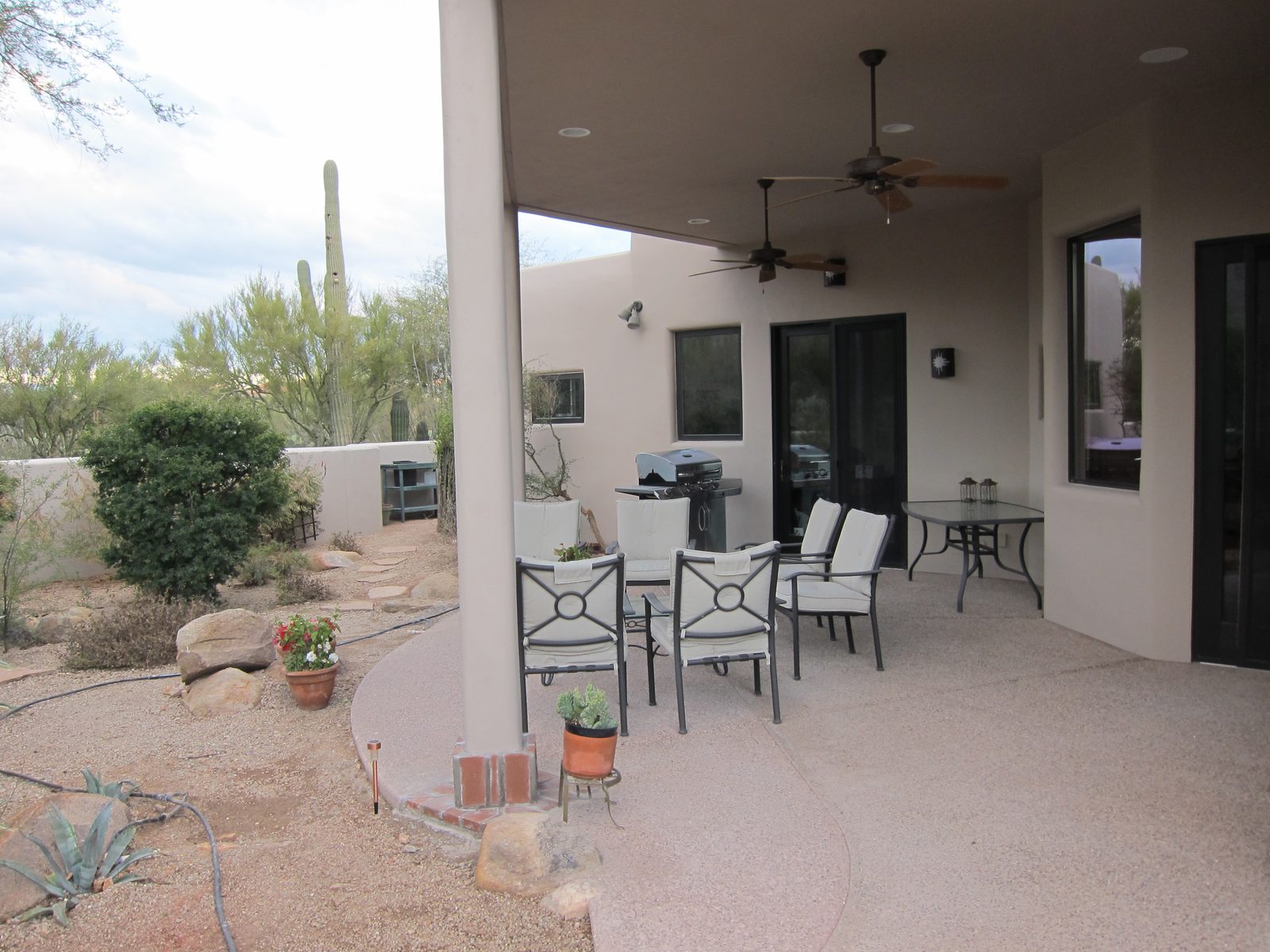 Another view of the patio.  The dining table wedged into the corner may be replaced by a serving shelf