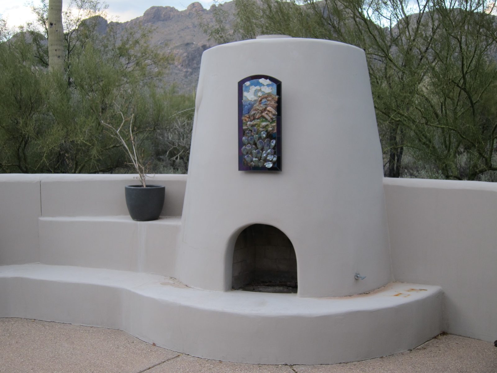 New art work over the kiva; echoes the scene behind it