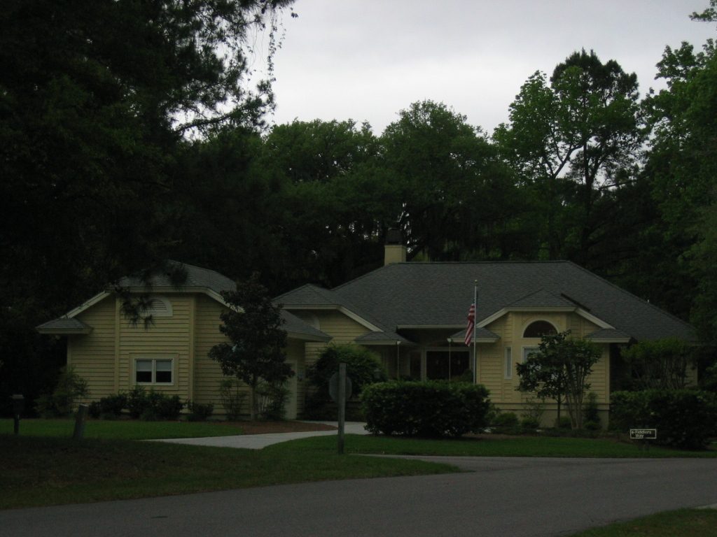 The house across the street, around the corner