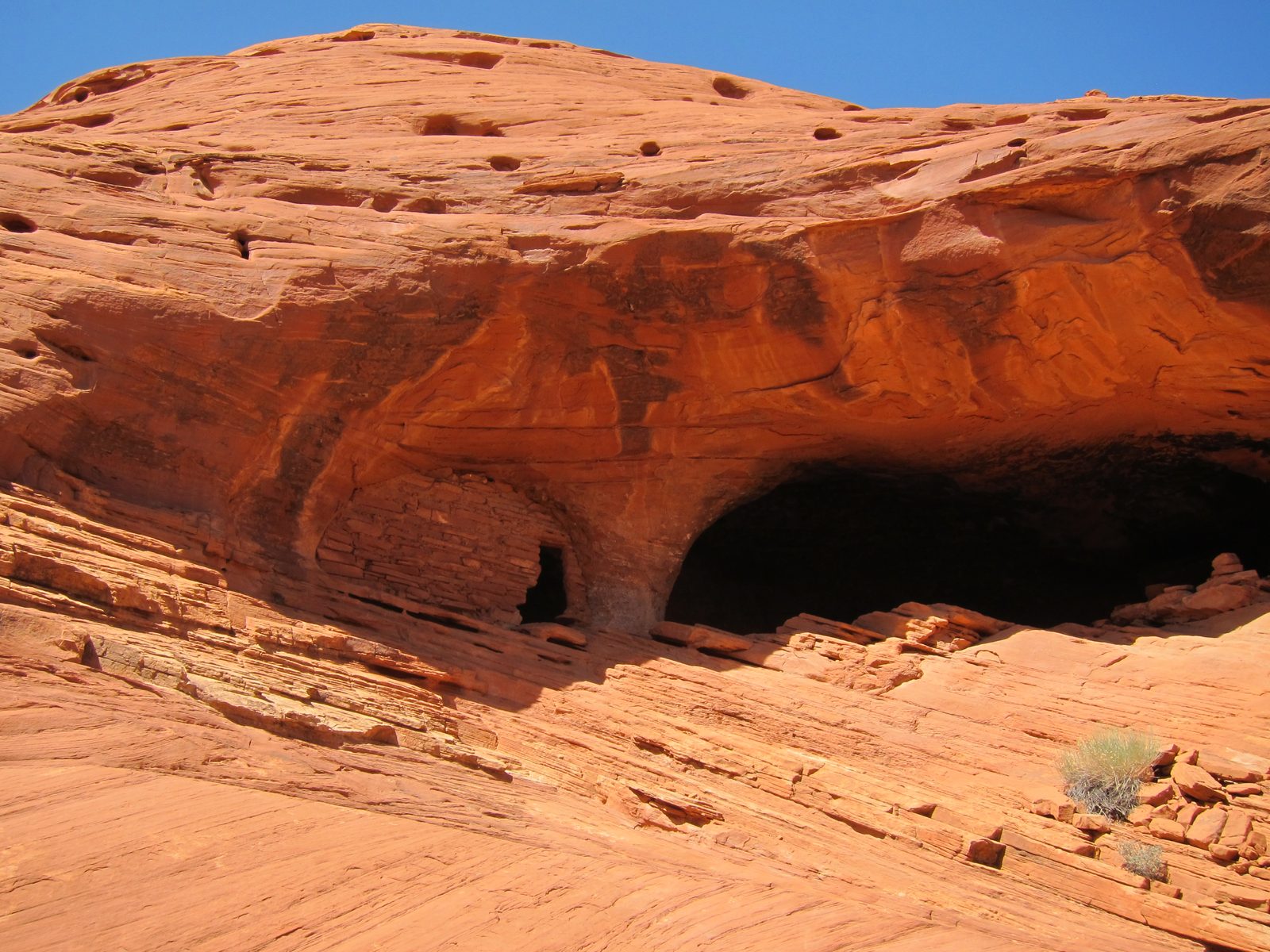 Interesting dwellings at the top of a slope.  Larsen said they believe the structure with the...