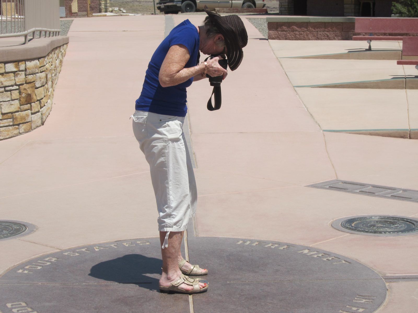 Joan getting a picture of her feet in four states 