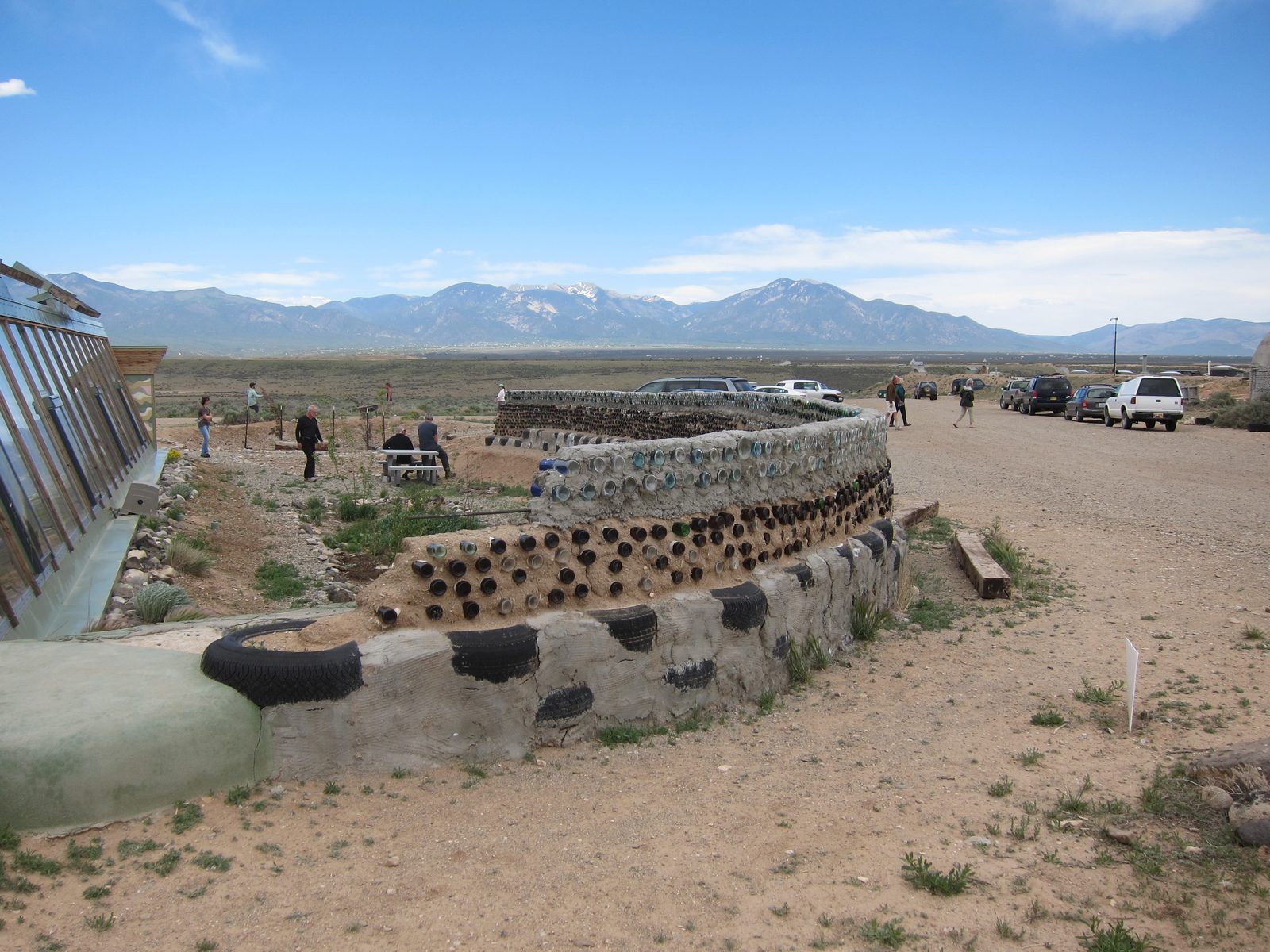 The walls are beer bottle / wine bottles / tires set into concrete.