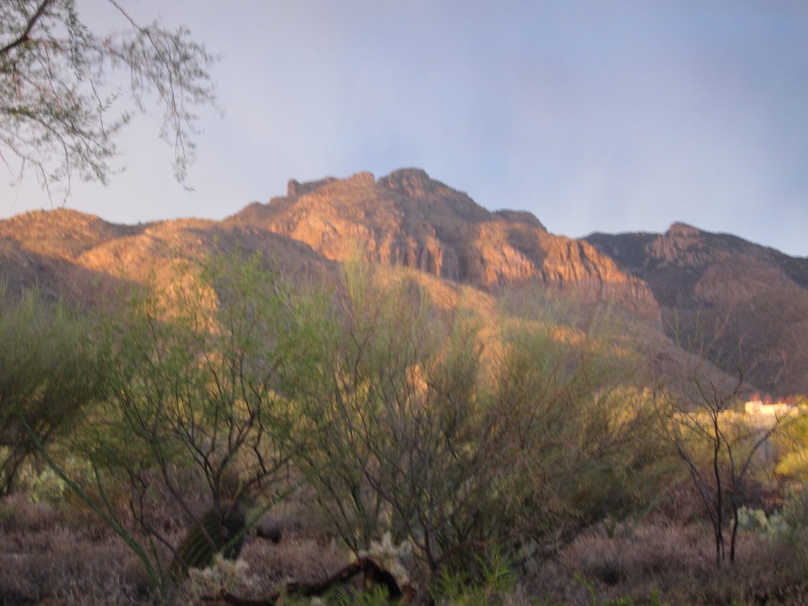 My memory of this was that the clouds disappeared and the setting sun illuminated the mountains 