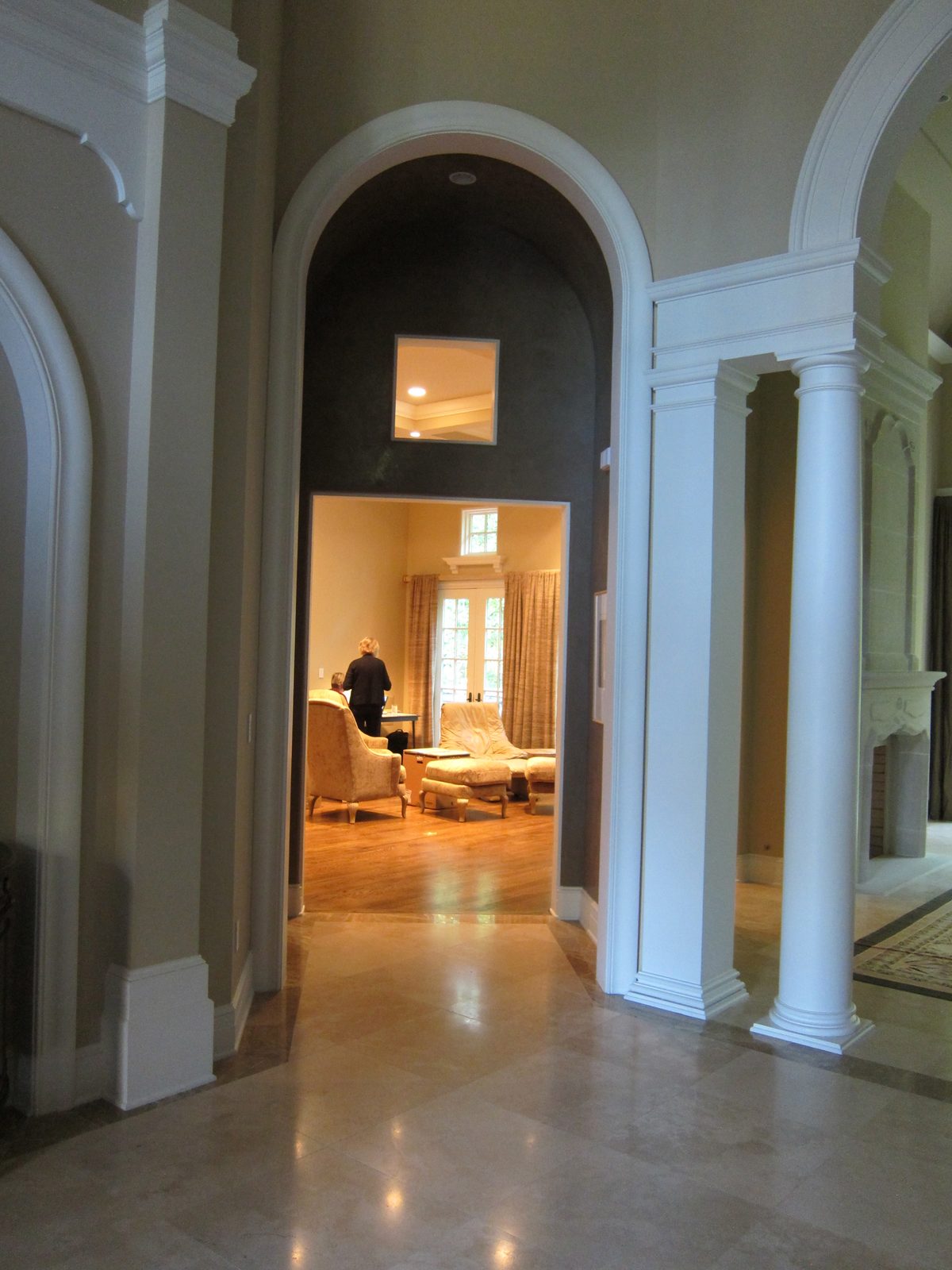 To left of living room arch is smaller arch leading into the family room.  There is a powder...