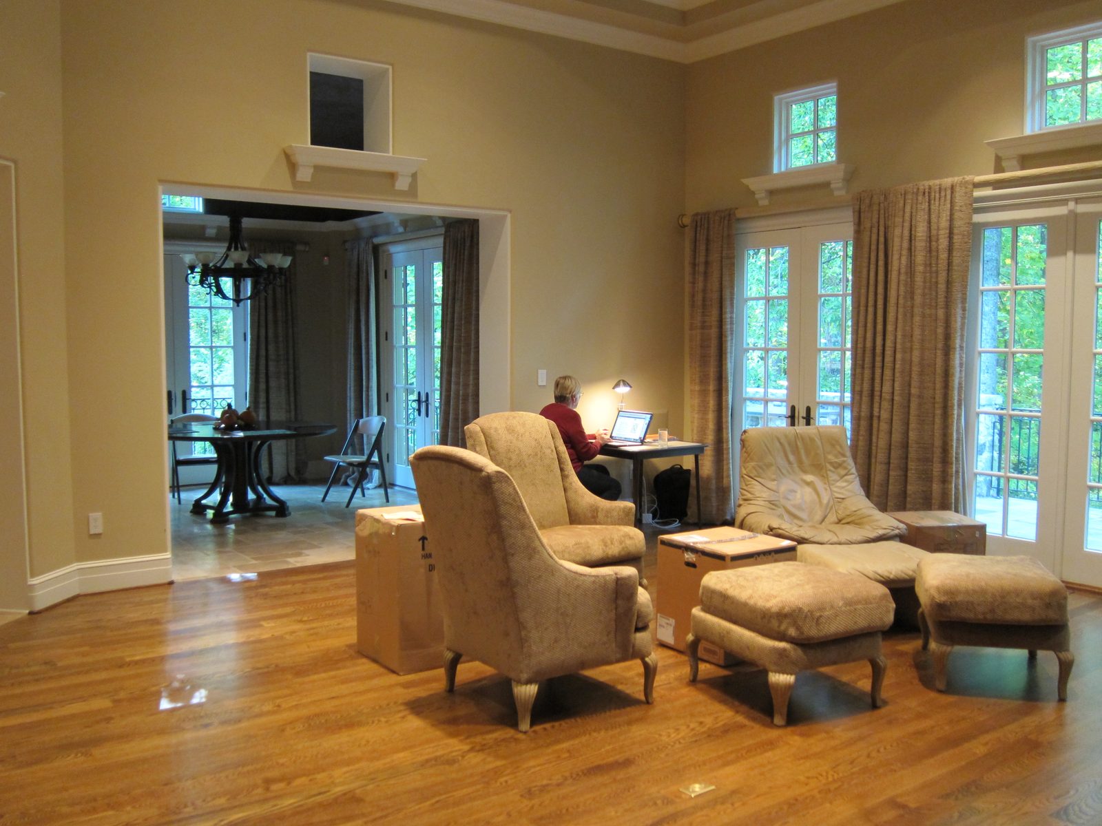 You are now in the family room.  Furniture "on order".  I think that's me on a computer.