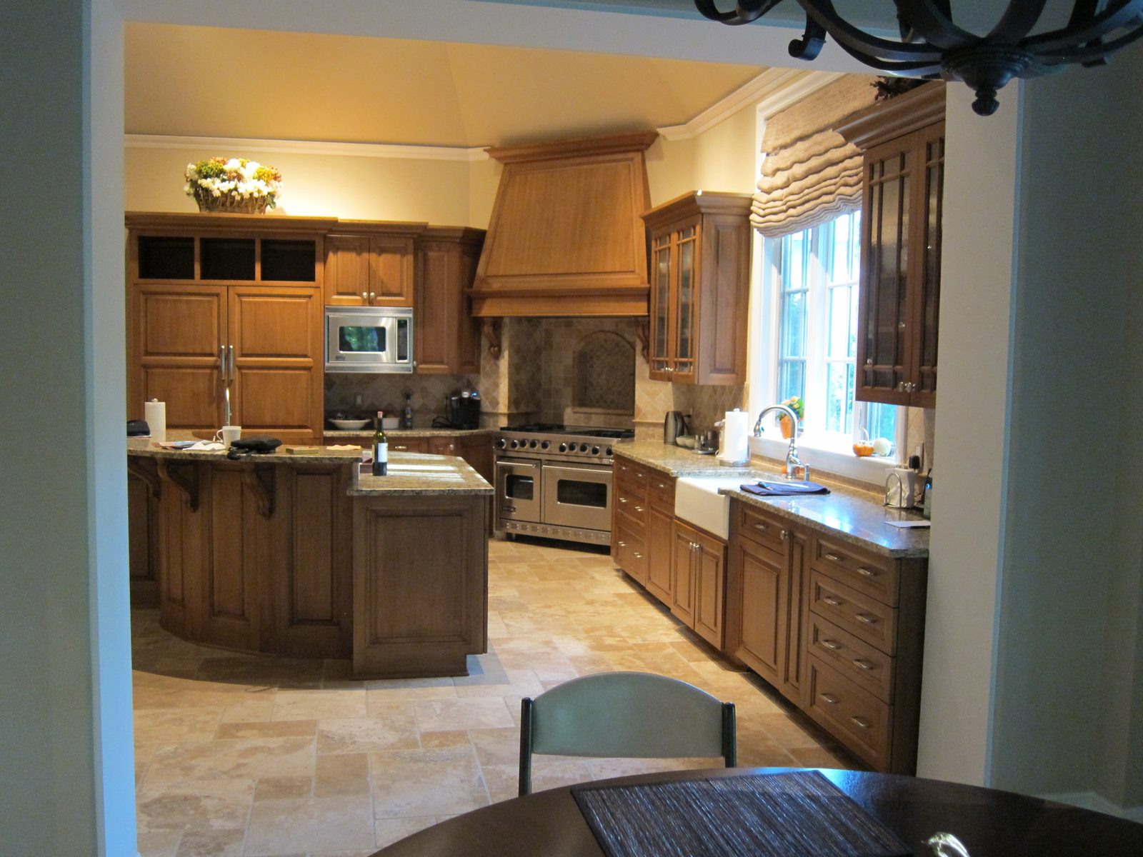 Kitchen as viewed from kitchen dining area which is "behind" family room.  The three rooms make...