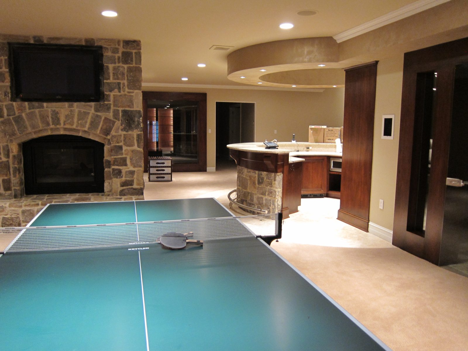 Ground floor (beneath the first floor) has a circular bar and three 60" TV's ... they could open...
