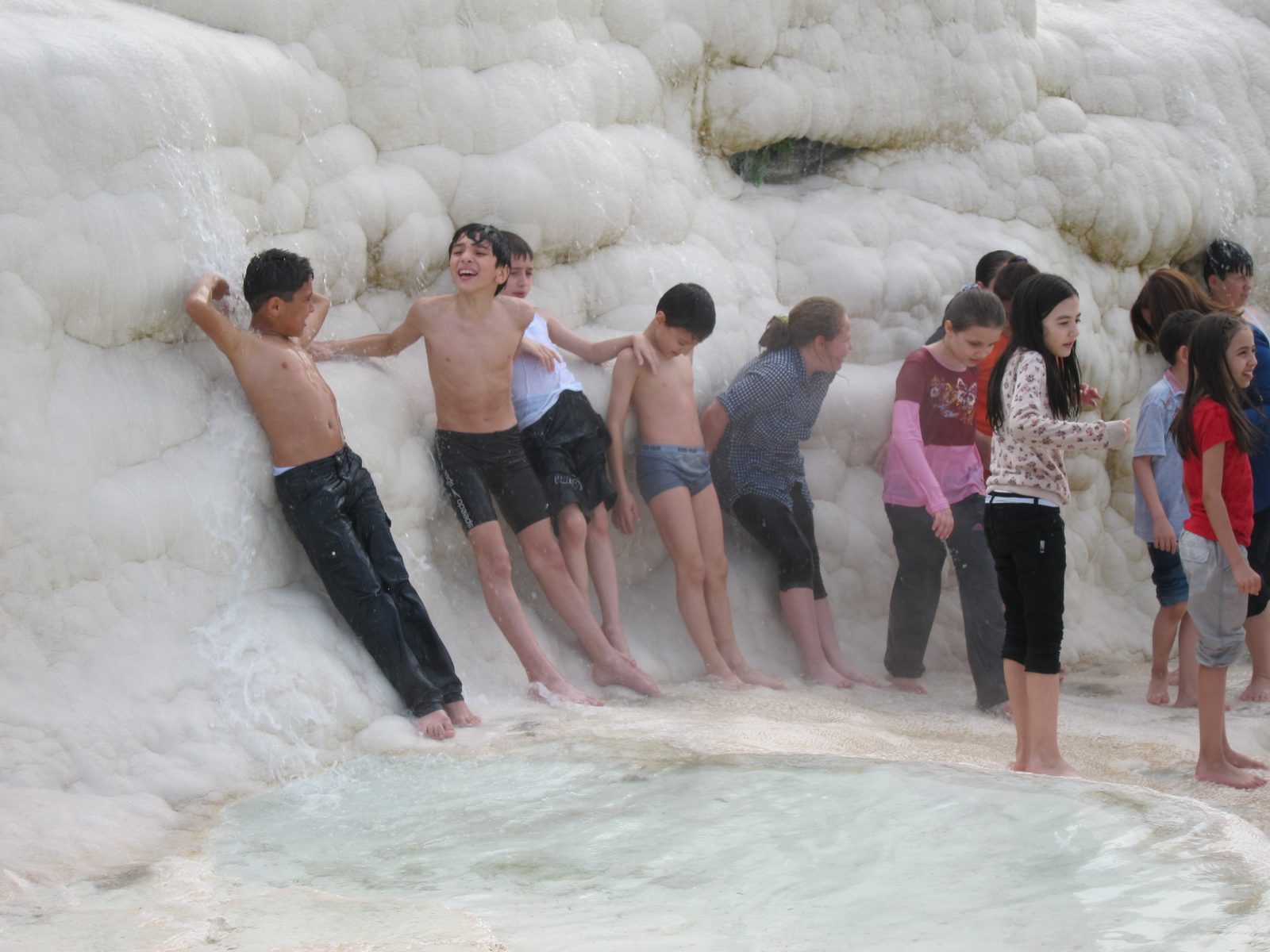These kids don't have socks on, and seem to be natives.