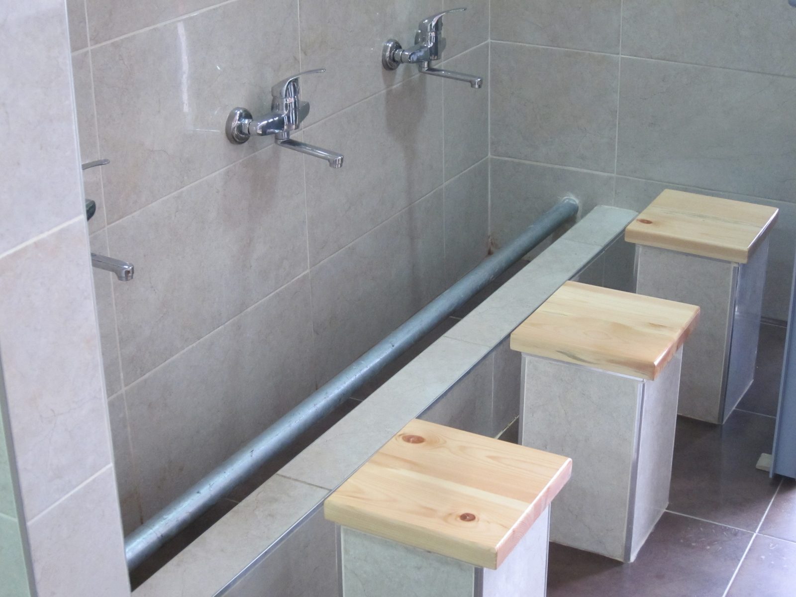 Also in the gas station.  Men's room. A place to wash your feet, which is required (suggested?)...