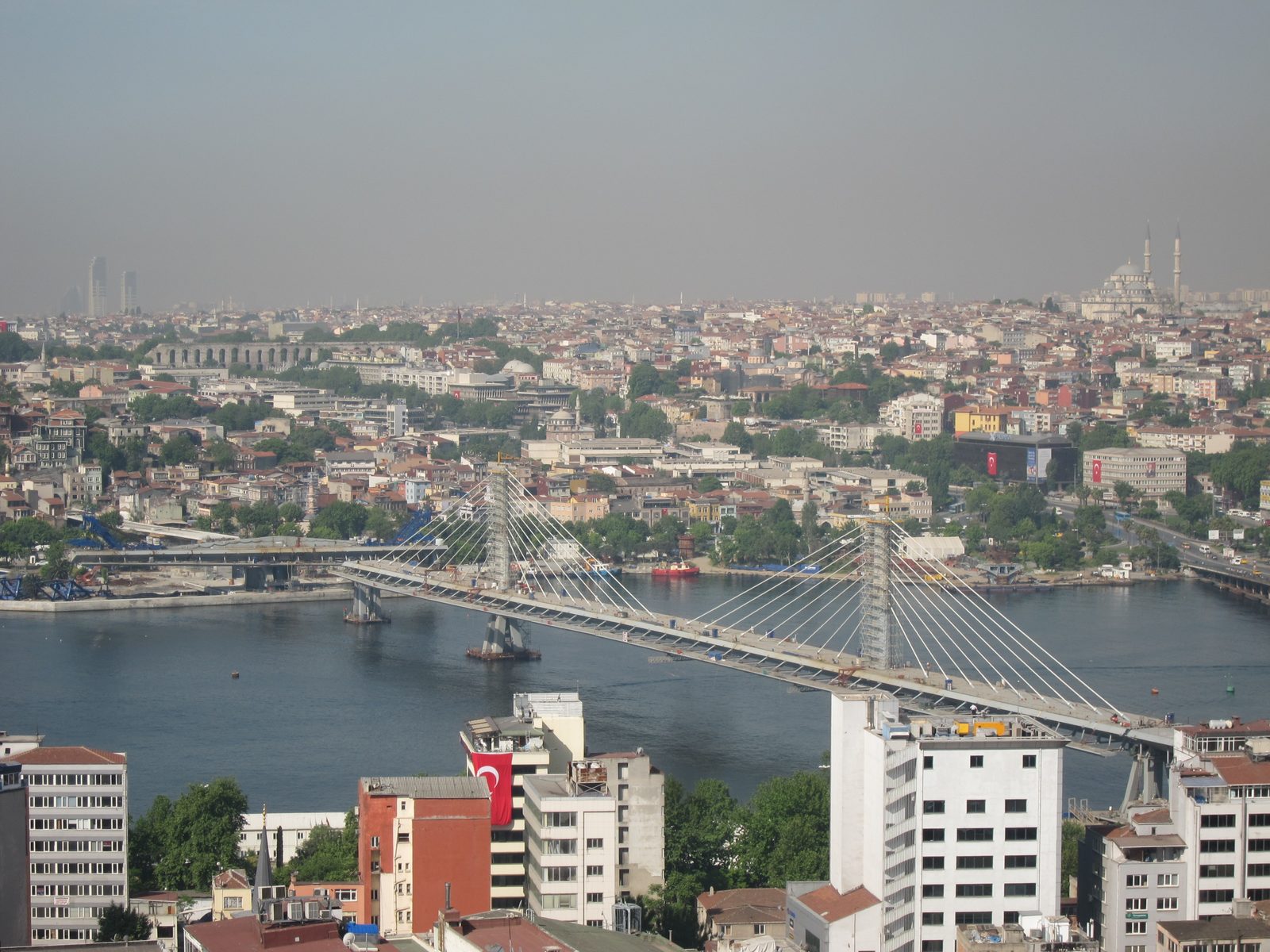 View of the new (under construction bridge across the Golden Horn from the top of the Galata Tower.
