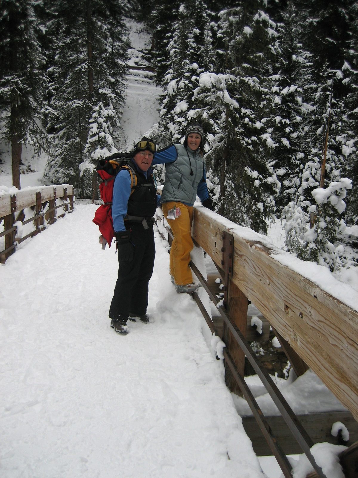 Dad and Catherine on a bridge over the South fork of the West fork of the Gallatin River, on the...