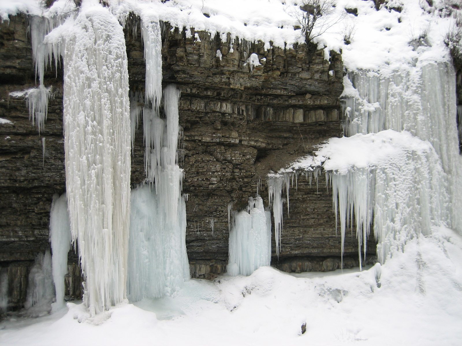 Water flows down off the cliff (and quickly turns to ice) on the side of the South Fork of the...