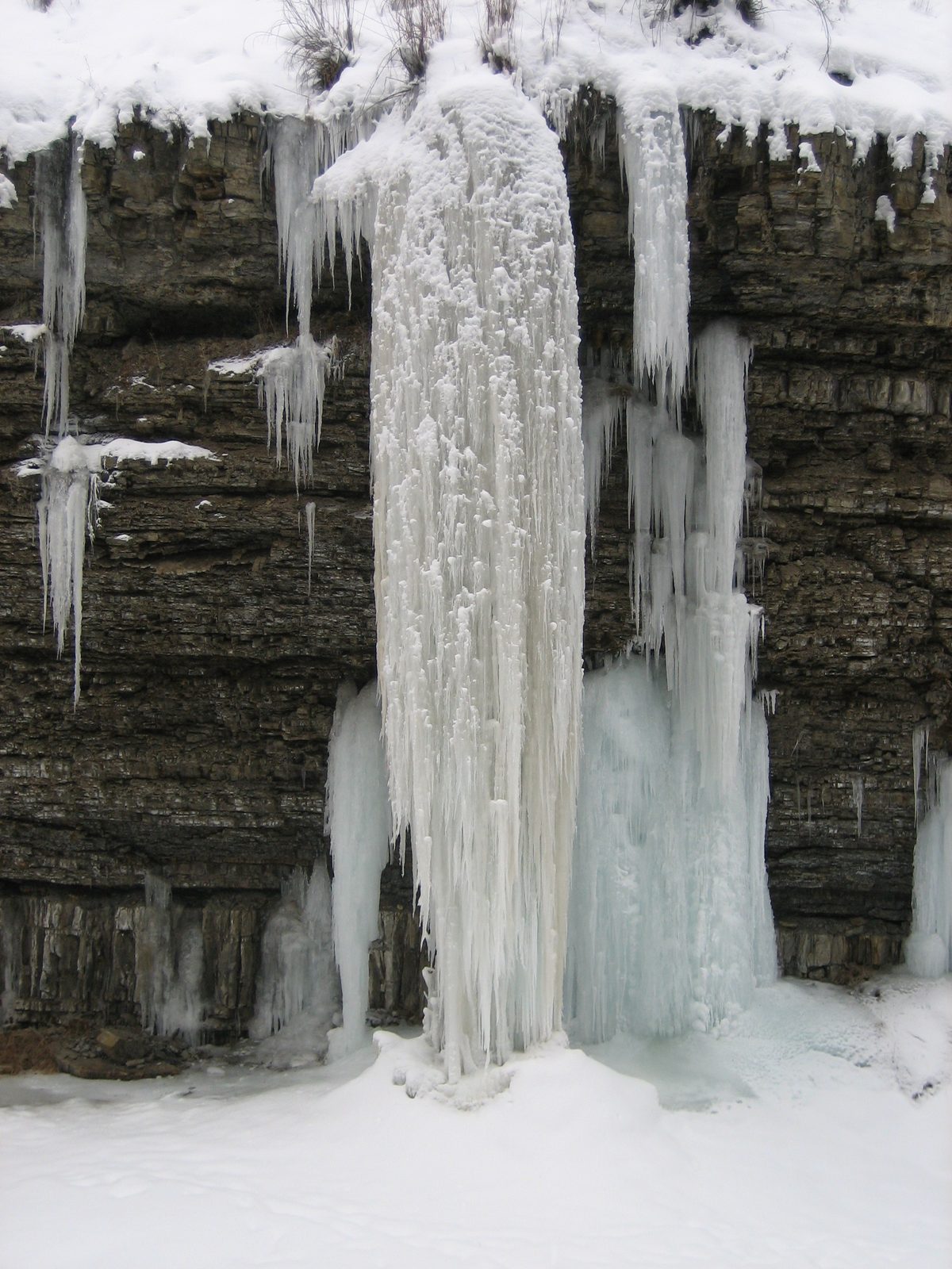 To say this is an "icicle" seems an understatement, no?

Ice floe off a cliff into the South...