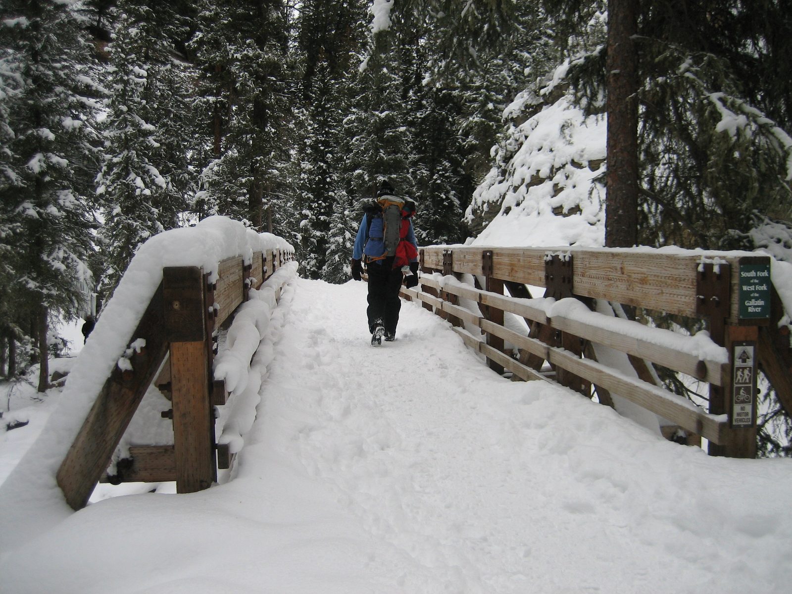 Dad walking across a bridge over the South Fork of the West Fork of the Gallatin River.