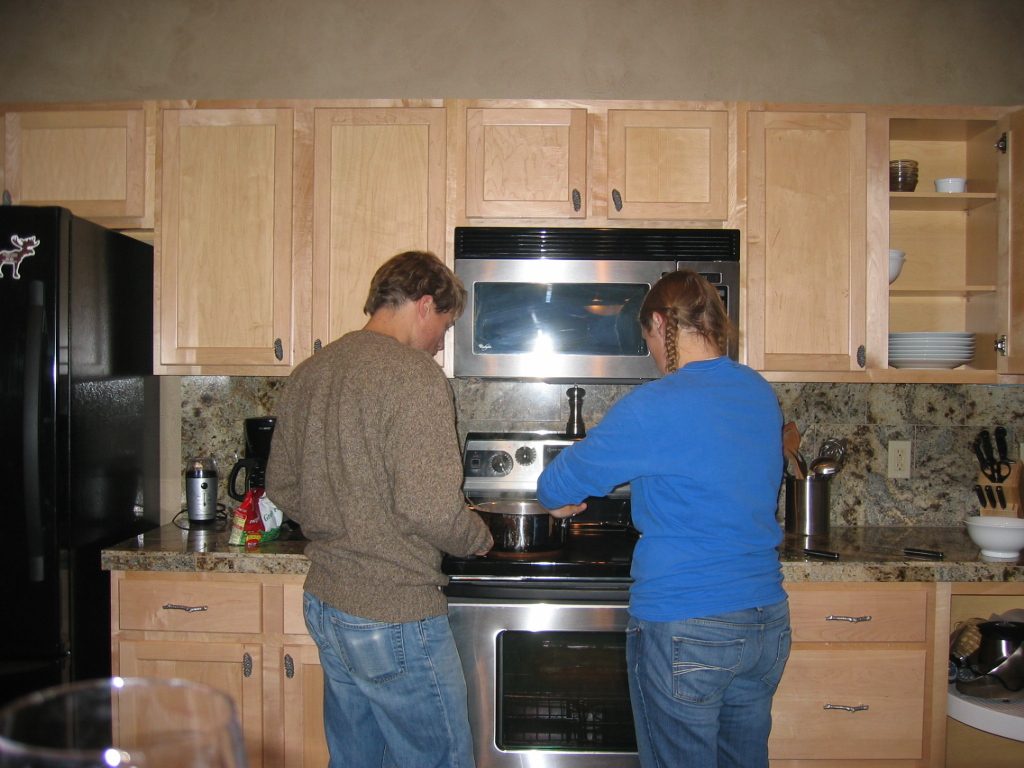 John and Catherine cooking dinner for the family.