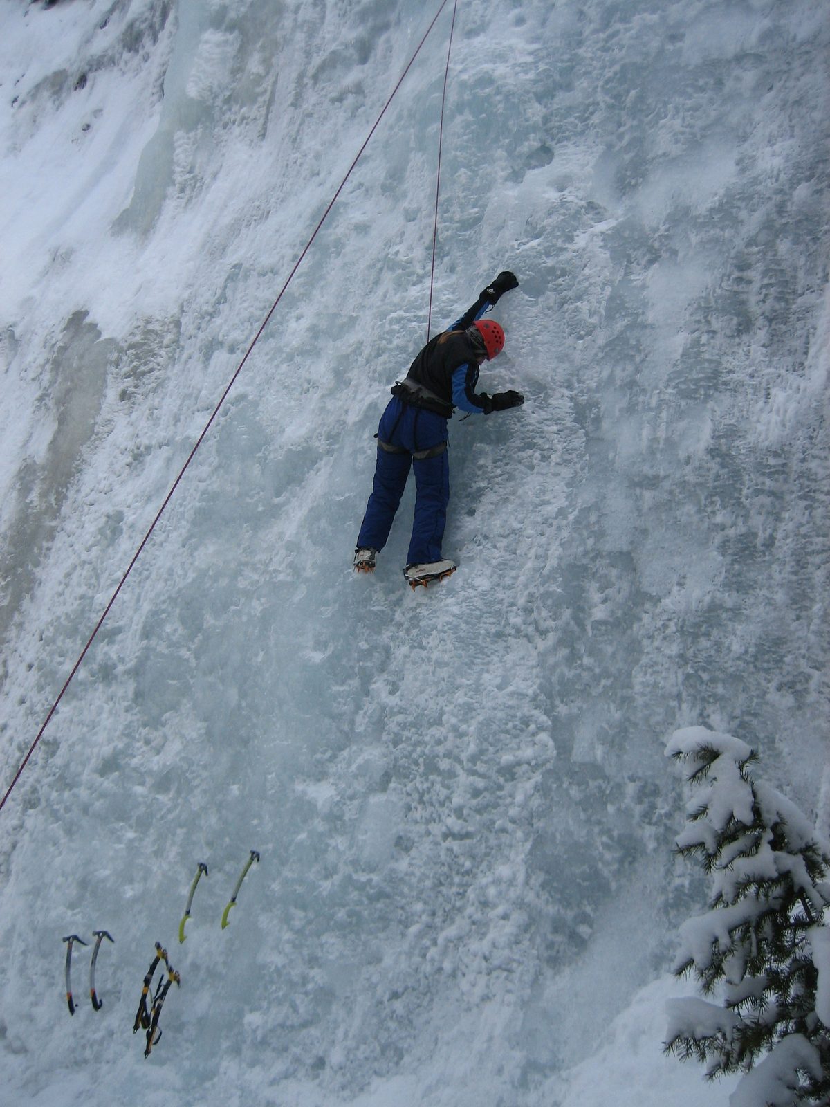 Catherine doing a sidepull /  lie back maneuver while climbing without tools.