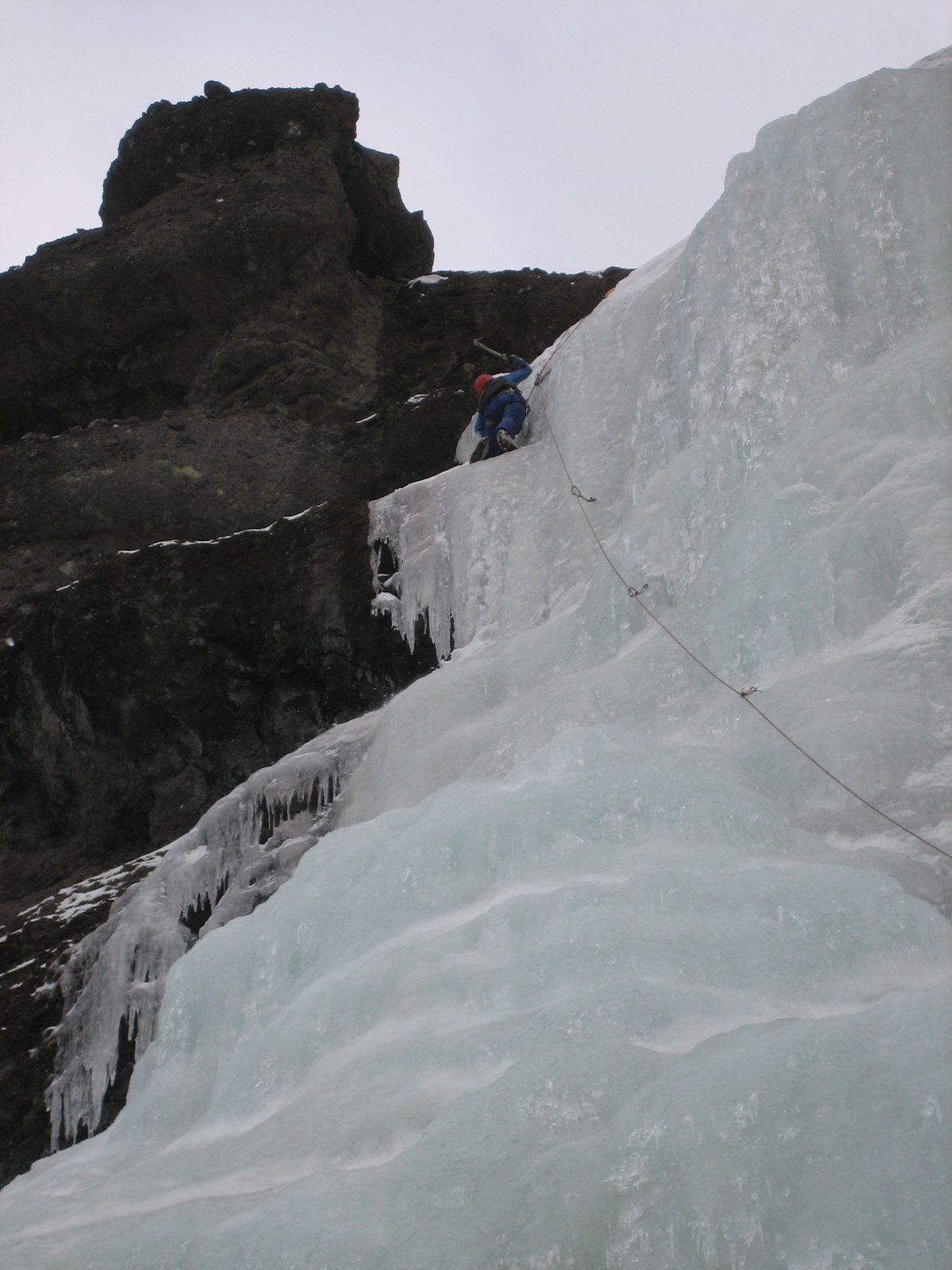 Catherine swinging away at the ice.