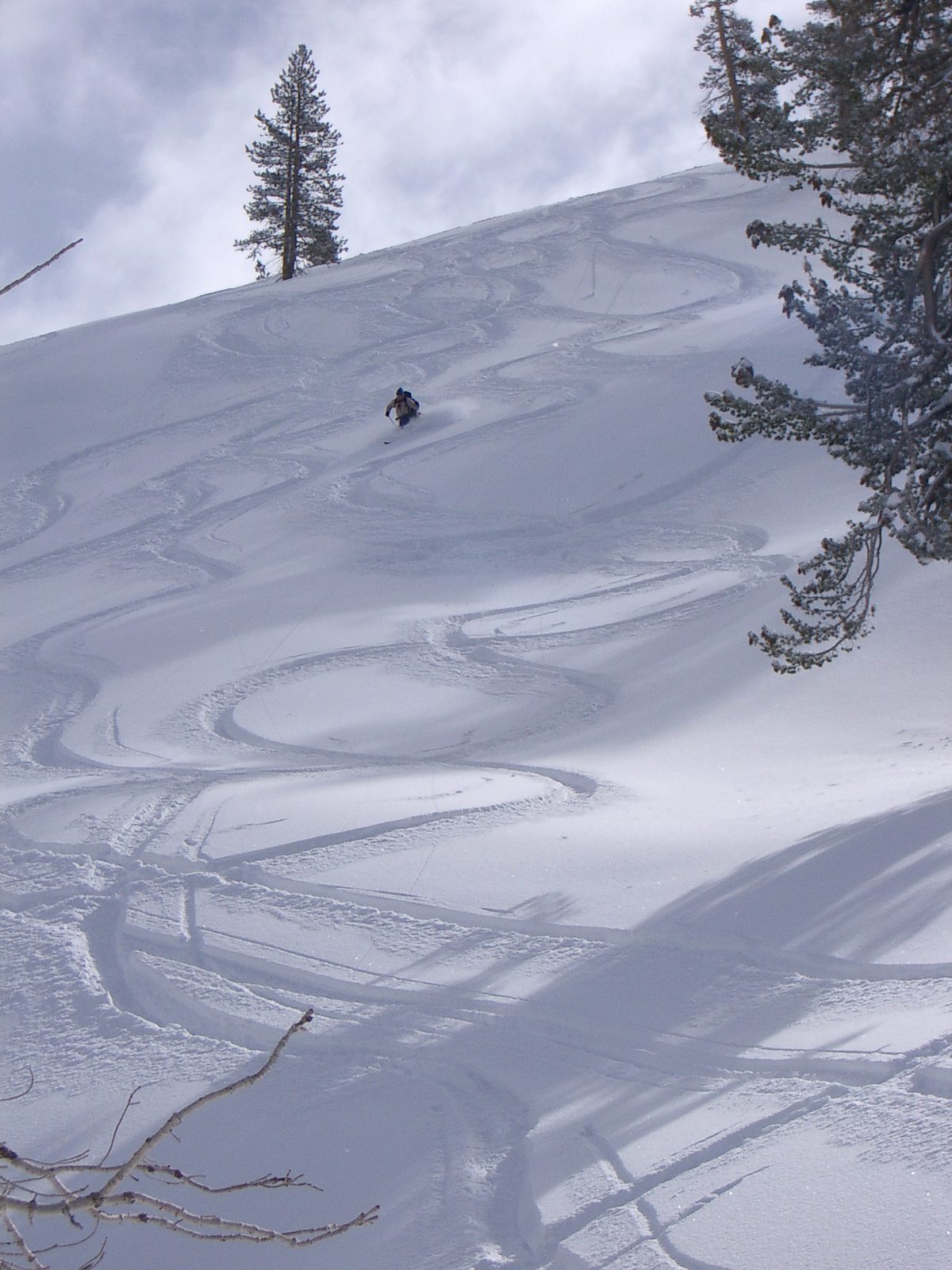 Last one off the hill:  John, making some semi-fresh tracks with a full pack the morning of our...